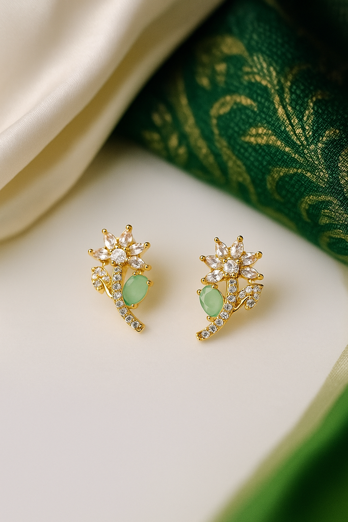 Emerald Petal Studs: Highlights the light green stone and the floral shape.